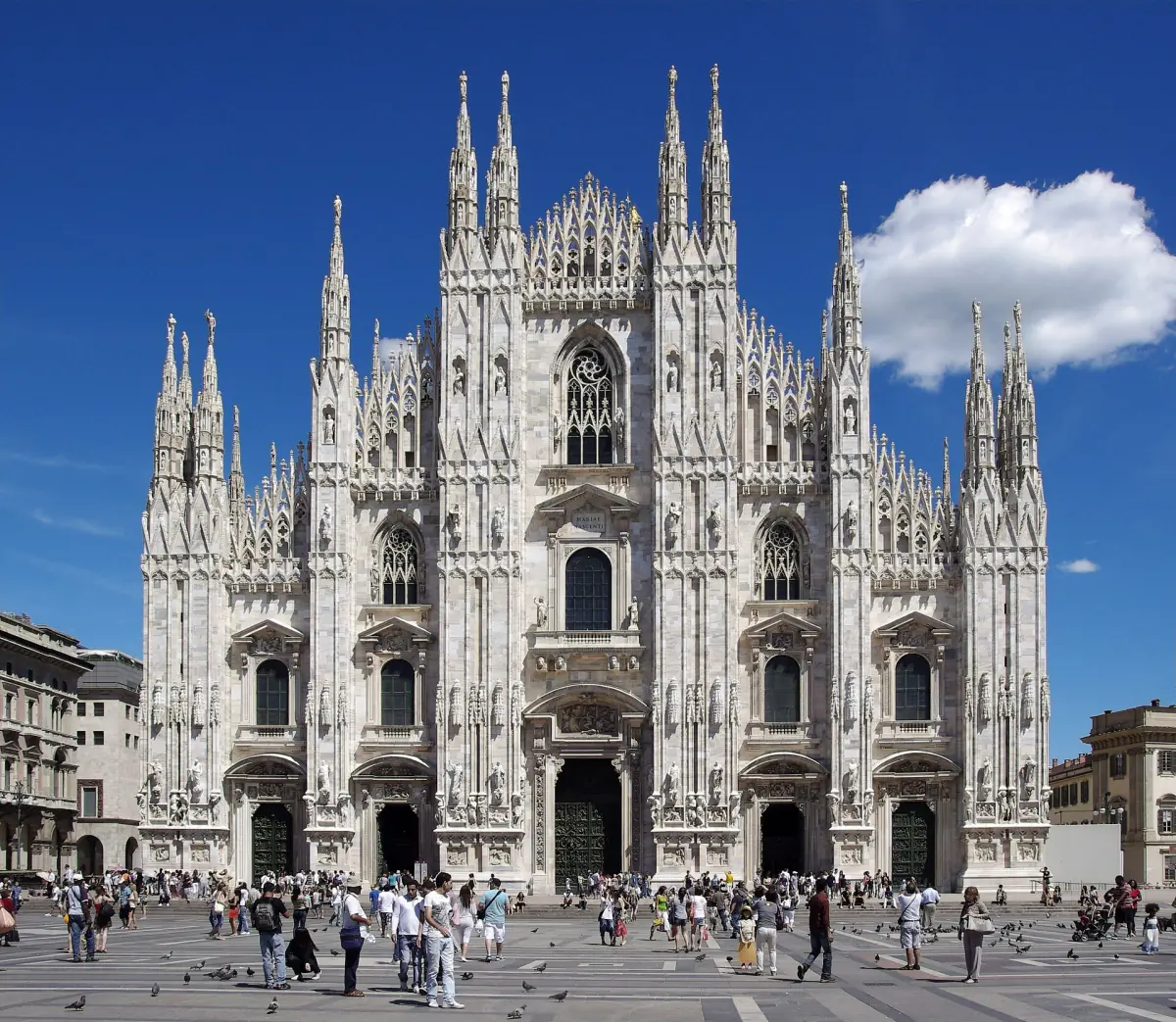 The white marble façade of Milan Cathedral on Piazza del Duomo