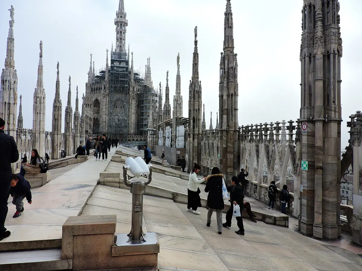 Visitors on the rooftop terraces among the spires